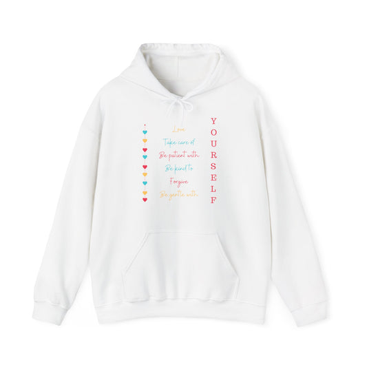 A white unisex hooded sweatshirt with 'Love Yourself' text and colorful heart illustrations on the front.