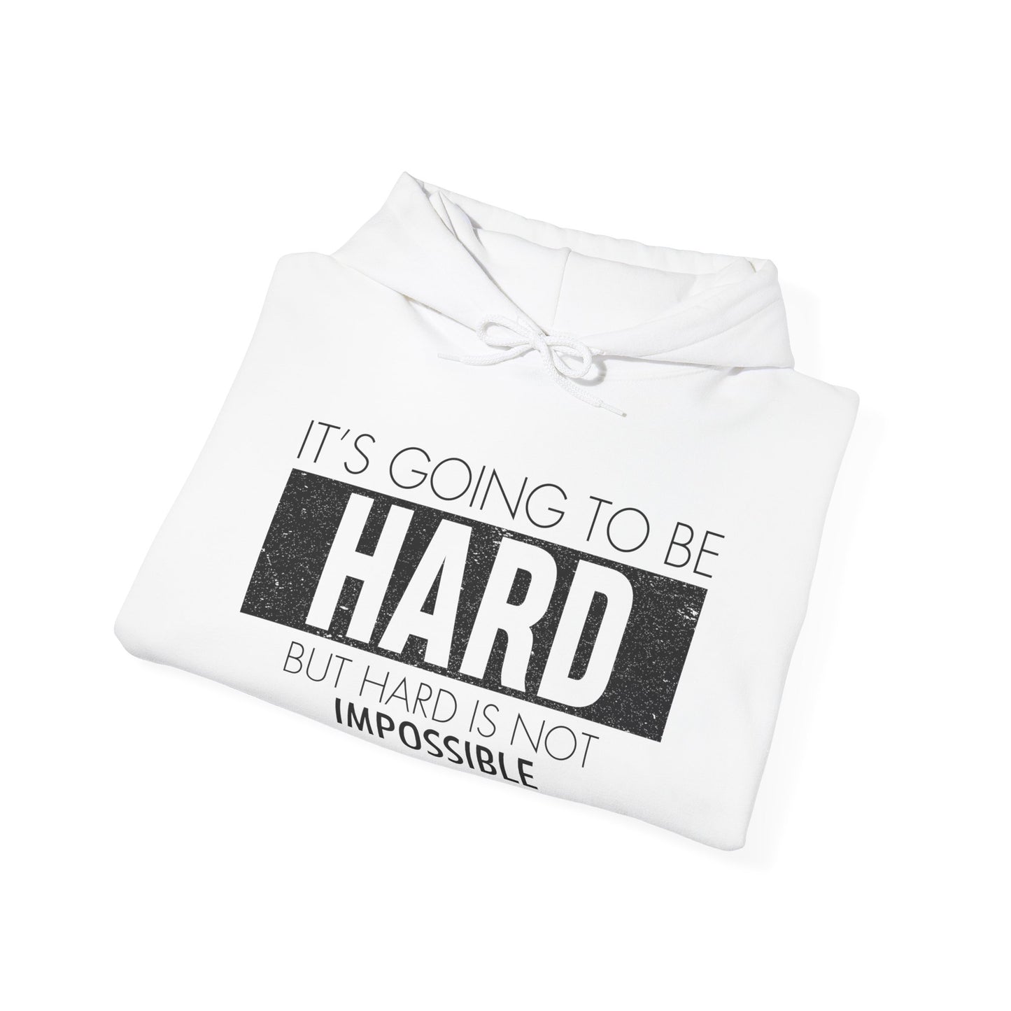 A folded white unisex hooded sweatshirt with the text 'It's Going To Be Hard BUT NOT IMPOSSIBLE' printed on the front.