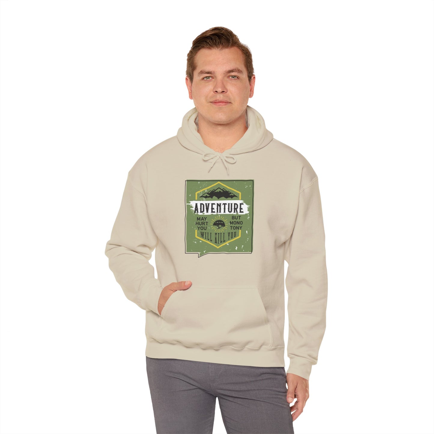 A person wearing a beige unisex hooded sweatshirt with the text 'Adventure' and a graphic design on the front.