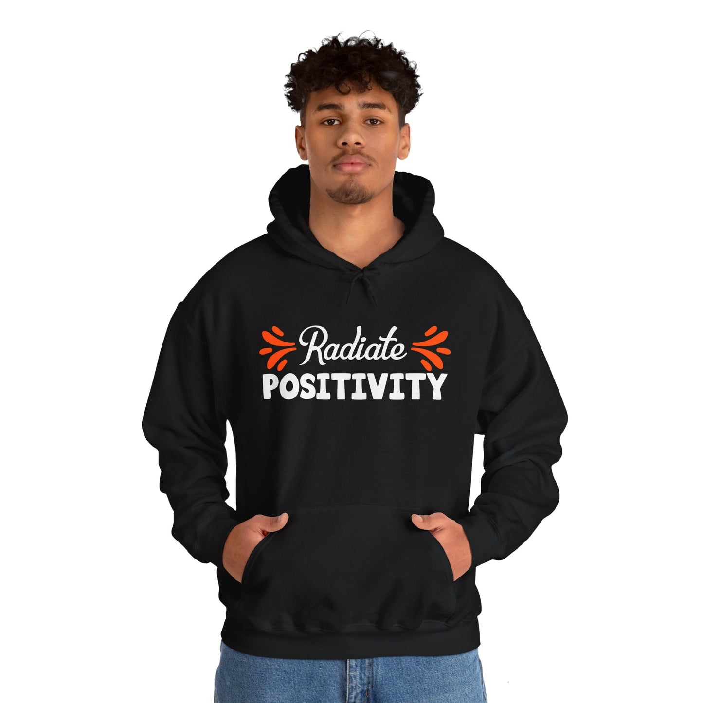 A person wearing a black unisex hooded sweatshirt with 'Radiate Positivity' text on the front.