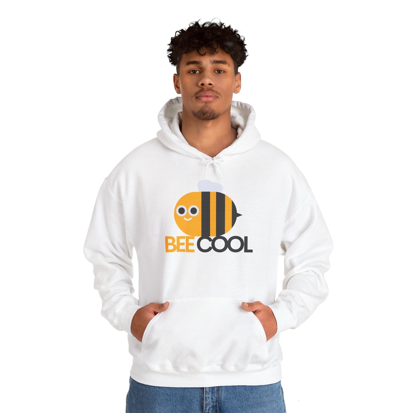 A male model wearing a white unisex hooded sweatshirt with 'BEE COOL' text and a bee graphic on the front.