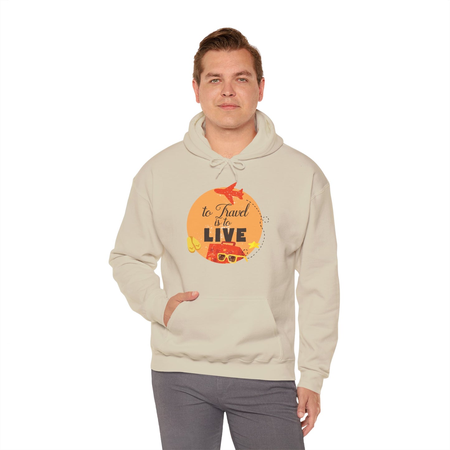 A male model wearing a beige unisex hooded sweatshirt with 'To Travel Is To Live' design on the front.