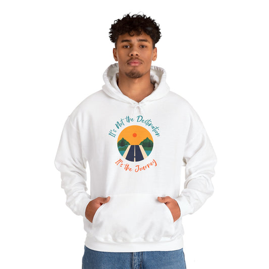 A man wearing a white unisex hooded sweatshirt with a motivational message 'It's Not The Destination It's The Journey' printed on the front.