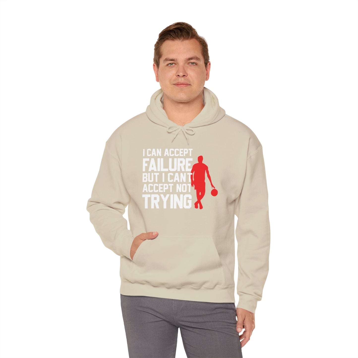 A person wearing a beige unisex hooded sweatshirt with text design on the front.
