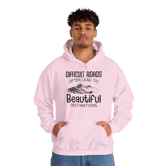 A unisex hooded sweatshirt with 'DIFFICULT ROADs OFTEN LEAD TO BEAUTIFUL DESTINATIONS' printed on the front.
