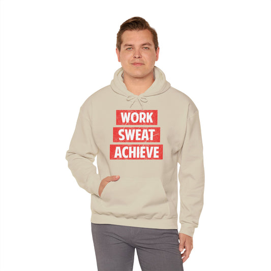 Person wearing a biege unisex hooded sweatshirt with 'WORK SWEAT ACHIEVE' text design in white and red.