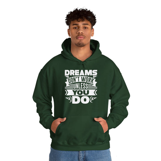 A person wearing a green unisex hooded sweatshirt with the text 'Dreams don't work unless you do' printed on the front.